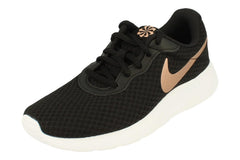 Black Nike womens Tanjun trainers with metallic bronze swoosh