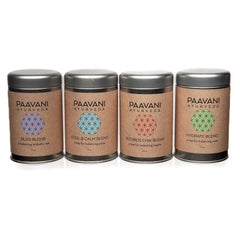 ayurvedic herbal tea collection featuring four unique blends in elegant tins.