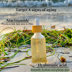 vegan glow up toner serum displayed on sandy beach with seaweed background
