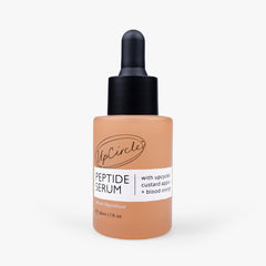 UpCircle peptide facial serum with custard apple and blood orange, showcasing the serum's smooth, vibrant orange-colored liquid.