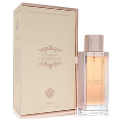 Lattafa The Kingdom perfume 3.4 oz EDP spray for women, shown next to its elegant cream and gold packaging box.