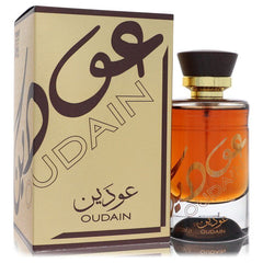 Lattafa Oudain Eau De Parfum 3.4 oz 100 ml spray bottle next to its gold packaging box.