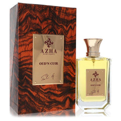 Azha Oud'n Cuir Eau De Parfum 3.3 oz / 100 ml spray bottle for men, shown next to its wood-patterned packaging box.