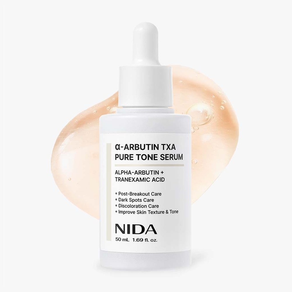 α-arbutin brightening serum for even skin tone in a dropper bottle against a light background.