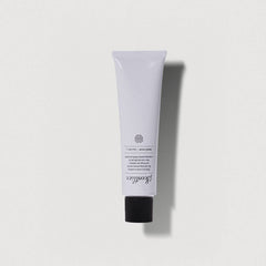 Scented hand cream with perfume in a sleek white tube for luxurious hand hydration and fragrance.