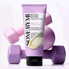 SOME BY MI retinol firming body cream tube with purple dumbbells. Vegan skincare to improve elasticity.