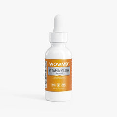 Bottle of WOW MD LLC Vitamin Glow Serum for facial care, showing the product's sleek packaging and vibrant label.
