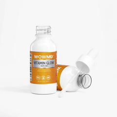 Bottle of WOW MD LLC Vitamin Glow Serum for facial care, showing the serum's sleek packaging and dropper applicator.