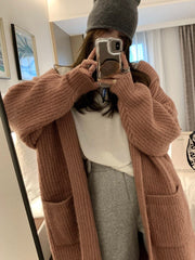 Veste-pull ample à capuche pour femme, de couleur unie