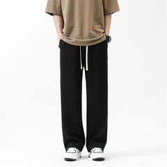 Pantalon de survêtement ample à jambes droites, avec cordon et chevilles à nouer