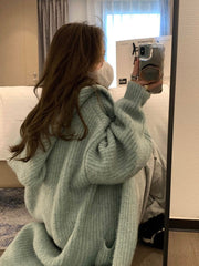 Veste-pull ample à capuche pour femme, de couleur unie