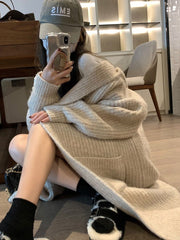 Veste-pull ample à capuche pour femme, de couleur unie