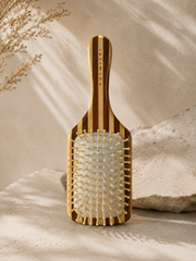 Bamboo Hairbrush by Francesco Palmieri, showcasing a sustainable bamboo hairbrush design for effortless detangling.