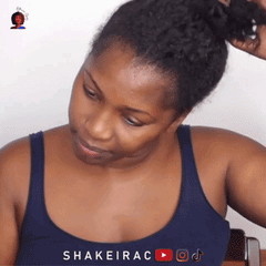 A woman demonstrating hair care techniques for high porosity moisture beauty box | H.E.A.L Hair Care