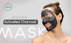 Woman applying activated charcoal face mask for a rejuvenating skincare treatment and radiant complexion.