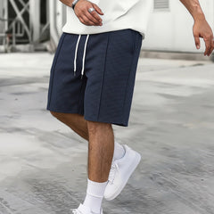 Short de sport ample à cordon pour homme