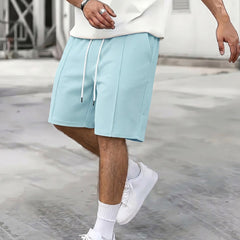 Short de sport ample à cordon pour homme