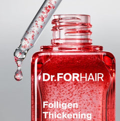 thickening scalp serum for fuller hair dropper applicator with serum dripping from it