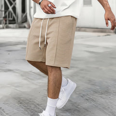 Short de sport ample à cordon pour homme