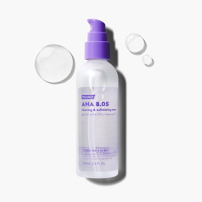 AHA exfoliating toner 100ml bottle with purple cap and cleansing droplets showcasing its exfoliating properties.