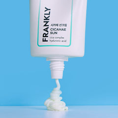 FRANKLY Cicahae Sun SPF50+ PA++++ lightweight daily sunscreen with SPF50 being squeezed from a tube.