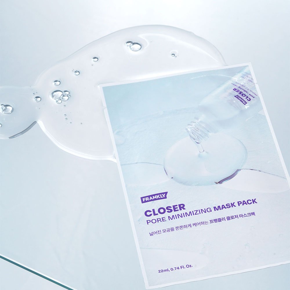 FRANKLY Closer Pore Minimizing Mask Pack on reflective surface with serum droplets, ideal pore minimizing sheet mask.