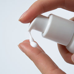 FRANKLY Sunday Glow Serum 37ml being dispensed on a finger, ideal glow serum for dull skin.