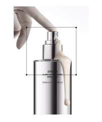 Creamy IOPE STEM III Emulsion flowing down the side of a sleek silver pump bottle pressed by a gloved finger.