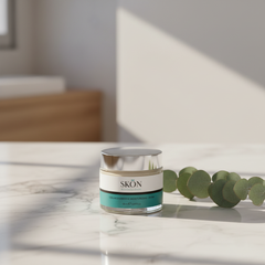 collagen marine moisturizer displayed on marble countertop with greenery