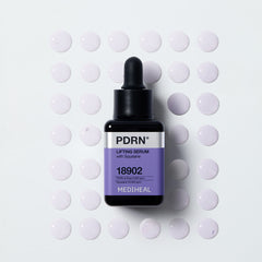 lifting serum with squalane bottle on a textured surface with drops around it