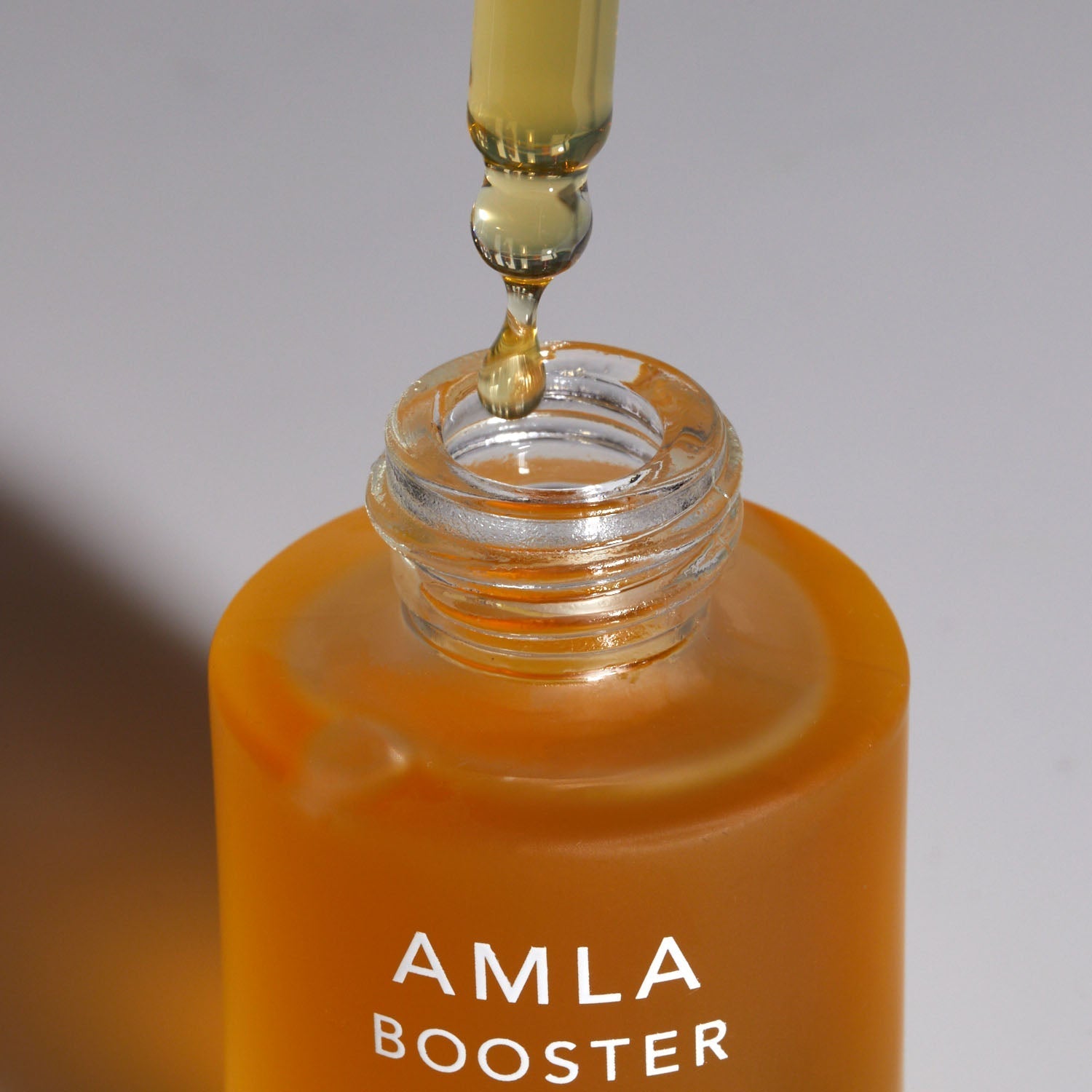 ayurvedic amla oil for face and hair dropper dispensing oil from bottle