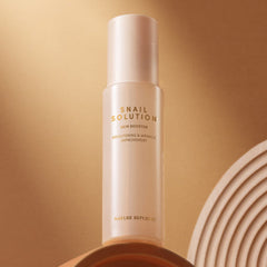 snail solution skin booster bottle on a minimalist background