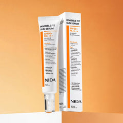 NIDA Invisible Fit Sun Serum SPF50+ PA++++ in packaging on a gradient background, showcasing its features and benefits.
