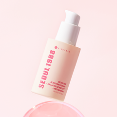 collagen boosting serum with red ginseng in an elegant bottle against a soft pink background.